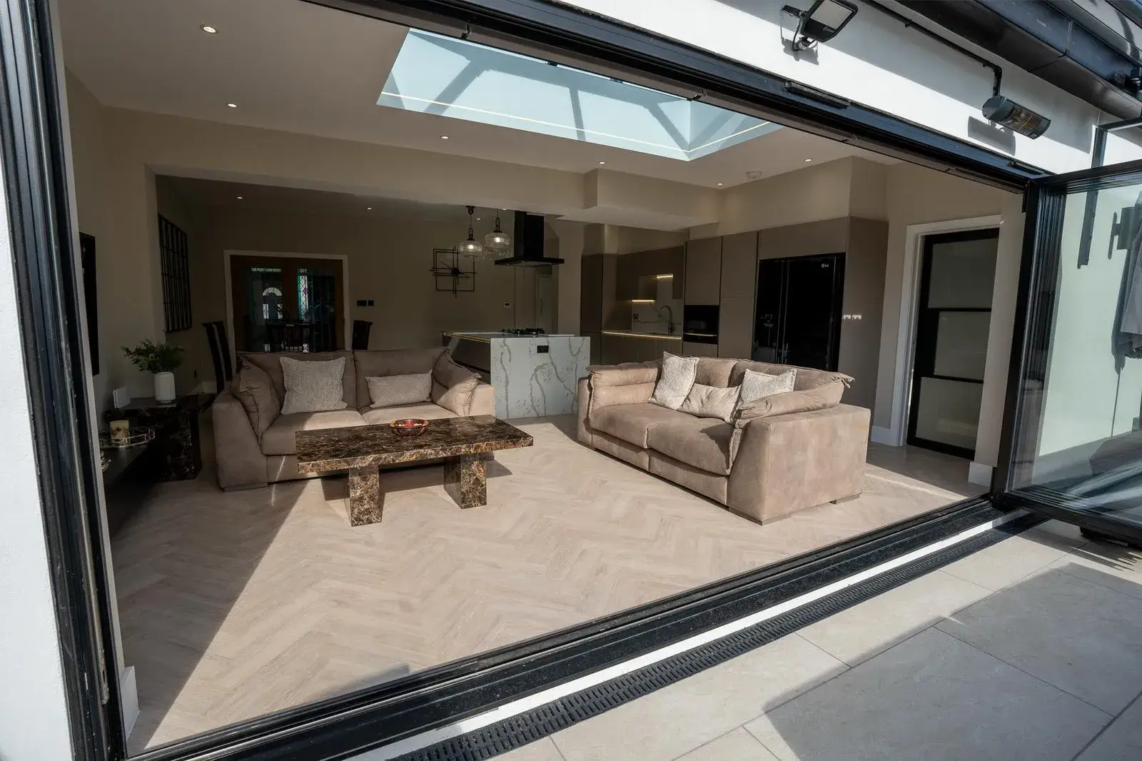 open side of patio with cream sofas