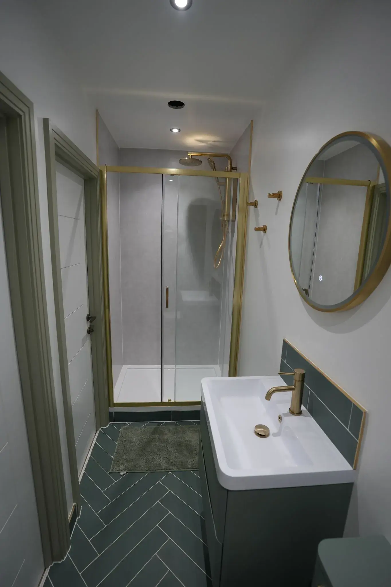 large bathroom with green tile flooring